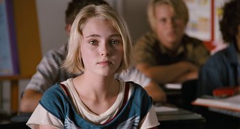 Movie still from “Bridge to Terabithia” (2007), directed by Gabor Csupo – A young girl sitting in front of two other people; Close Up shot, Over the shoulder angle