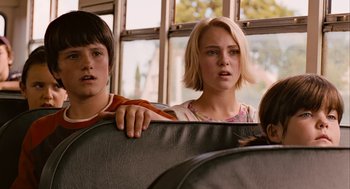 Movie still from “Bridge to Terabithia” (2007), directed by Gabor Csupo – Two young people are sitting on a bus together; Close Up shot, Low angle