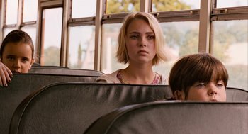 Movie still from “Bridge to Terabithia” (2007), directed by Gabor Csupo – A woman sitting on a bus looking at the camera; Close Up shot, Over the shoulder angle