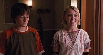 Movie still from “Bridge to Terabithia” (2007), directed by Gabor Csupo – A young boy and a young girl standing next to each other; Medium shot, Over the shoulder angle