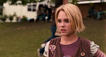Movie still from “Bridge to Terabithia” (2007), directed by Gabor Csupo – A young woman with blonde hair wearing a purple shirt; Close Up shot, Over the shoulder angle