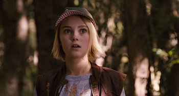 Movie still from “Bridge to Terabithia” (2007), directed by Gabor Csupo – A young woman with a hat on looking at the camera; Close Up shot, Over the shoulder angle