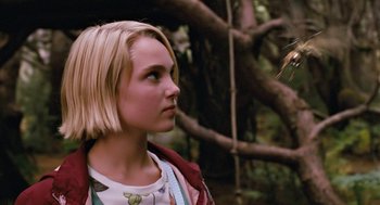 Movie still from “Bridge to Terabithia” (2007), directed by Gabor Csupo – A young blonde woman looking to her left; Close Up shot, Over the shoulder angle