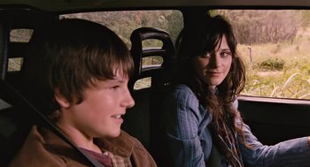 Movie still from “Bridge to Terabithia” (2007), directed by Gabor Csupo – A woman and a young boy sitting in the back seat of a car; Close Up shot, Over the shoulder angle
