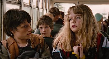 Movie still from “Bridge to Terabithia” (2007), directed by Gabor Csupo – A group of young people sitting on a bus together; Close Up shot, Over the shoulder angle