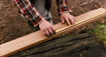 Movie still from “Bridge to Terabithia” (2007), directed by Gabor Csupo – A man measuring a piece of wood with a tape measure; Extreme Close Up shot, Low angle