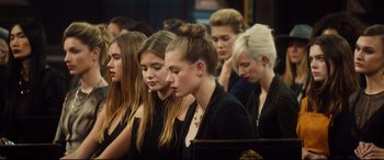 Movie still from “Bridget Jones's Baby” (2016), directed by Sharon Maguire – A group of young women sitting next to each other; Close Up shot, High angle