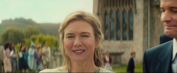 Movie still from “Bridget Jones's Baby” (2016), directed by Sharon Maguire – A person smiling for the camera; Close Up shot, Low angle