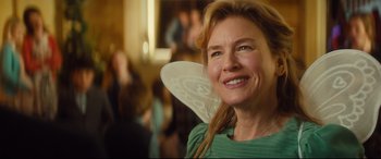 Movie still from “Bridget Jones's Baby” (2016), directed by Sharon Maguire – A person wearing a fairy costume; Close Up shot, Over the shoulder angle