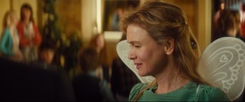 Movie still from “Bridget Jones's Baby” (2016), directed by Sharon Maguire – A person wearing a green shirt; Close Up shot, Over the shoulder angle