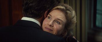 Movie still from “Bridget Jones's Baby” (2016), directed by Sharon Maguire – A person hugging another person; Close Up shot, Over the shoulder angle