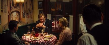 Movie still from “Bridget Jones's Baby” (2016), directed by Sharon Maguire – A man and a woman sitting at a dinner table; Medium shot, Over the shoulder angle