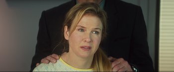 Movie still from “Bridget Jones's Baby” (2016), directed by Sharon Maguire – A person with her hands on her shoulder; Close Up shot, Over the shoulder angle