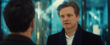 Movie still from “Bridget Jones's Baby” (2016), directed by Sharon Maguire – A man in a black jacket is looking at another man in a white shirt; Close Up shot, Over the shoulder angle