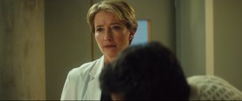 Movie still from “Bridget Jones's Baby” (2016), directed by Sharon Maguire – A person wearing a lab coat; Close Up shot, Over the shoulder angle