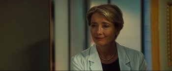 Movie still from “Bridget Jones's Baby” (2016), directed by Sharon Maguire – A person wearing a lab coat; Close Up shot, Over the shoulder angle