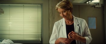 Movie still from “Bridget Jones's Baby” (2016), directed by Sharon Maguire – A woman in a black shirt and a white jacket; Medium shot, Over the shoulder angle