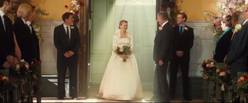 Movie still from “Bridget Jones's Baby” (2016), directed by Sharon Maguire – A woman in a wedding dress holding a bouquet of flowers; Wide shot, Low angle