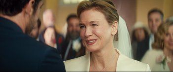 Movie still from “Bridget Jones's Baby” (2016), directed by Sharon Maguire – A person wearing a wedding dress; Close Up shot, Over the shoulder angle