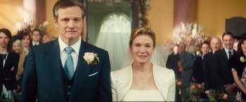 Movie still from “Bridget Jones's Baby” (2016), directed by Sharon Maguire – A man and a woman standing next to each other in front of a doorway; Close Up shot, Low angle