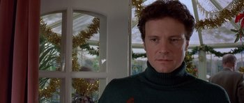 Movie still from “Bridget Jones's Diary” (2001), directed by Sharon Maguire – A person wearing a green sweater; Close Up shot, Over the shoulder angle