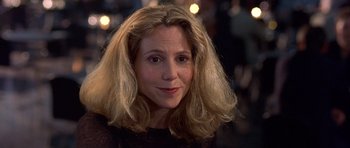 Movie still from “Bridget Jones's Diary” (2001), directed by Sharon Maguire – A person with long blonde hair; Close Up shot, Over the shoulder angle