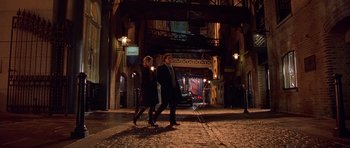 Movie still from “Bridget Jones's Diary” (2001), directed by Sharon Maguire – A couple of people that are walking in the dark; Wide shot, High angle