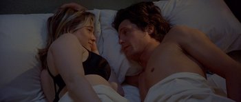 Movie still from “Bridget Jones's Diary” (2001), directed by Sharon Maguire – A man and a woman laying in a bed together; Close Up shot, High angle