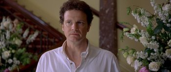 Movie still from “Bridget Jones's Diary” (2001), directed by Sharon Maguire – A person wearing a white shirt; Close Up shot, Over the shoulder angle