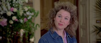 Movie still from “Bridget Jones's Diary” (2001), directed by Sharon Maguire – A person wearing a jean jacket; Close Up shot, Over the shoulder angle