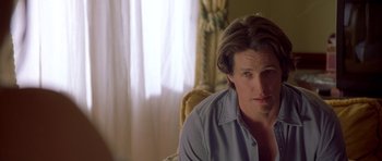 Movie still from “Bridget Jones's Diary” (2001), directed by Sharon Maguire – A person sitting in a chair; Close Up shot, Over the shoulder angle