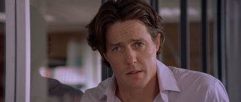 Movie still from “Bridget Jones's Diary” (2001), directed by Sharon Maguire – A person wearing a white shirt; Close Up shot, Over the shoulder angle