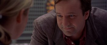 Movie still from “Bridget Jones's Diary” (2001), directed by Sharon Maguire – A person wearing a suit and tie; Close Up shot, Over the shoulder angle