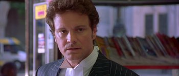 Movie still from “Bridget Jones's Diary” (2001), directed by Sharon Maguire – A person wearing a suit and tie; Close Up shot, Over the shoulder angle