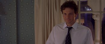 Movie still from “Bridget Jones's Diary” (2001), directed by Sharon Maguire – A person wearing a shirt and a tie; Close Up shot, Over the shoulder angle