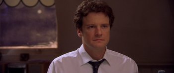 Movie still from “Bridget Jones's Diary” (2001), directed by Sharon Maguire – A person wearing a shirt and a tie; Close Up shot, Over the shoulder angle