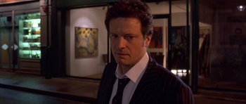 Movie still from “Bridget Jones's Diary” (2001), directed by Sharon Maguire – A person wearing a suit and tie; Close Up shot, High angle