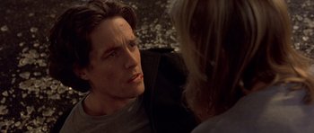 Movie still from “Bridget Jones's Diary” (2001), directed by Sharon Maguire – A man and a woman talking to each other; Close Up shot, Over the shoulder angle