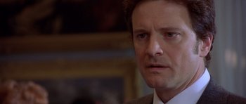 Movie still from “Bridget Jones's Diary” (2001), directed by Sharon Maguire – A person wearing a suit and tie; Close Up shot, Over the shoulder angle