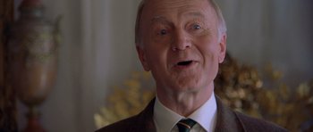 Movie still from “Bridget Jones's Diary” (2001), directed by Sharon Maguire – An older man with a surprised look on his face; Close Up shot, Low angle
