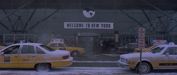 Movie still from “Bridget Jones's Diary” (2001), directed by Sharon Maguire – A group of people standing in front of a building; Extreme Wide shot, High angle