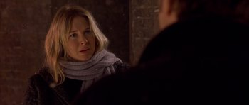 Movie still from “Bridget Jones's Diary” (2001), directed by Sharon Maguire – A woman wearing a scarf looking in the mirror; Close Up shot, Over the shoulder angle