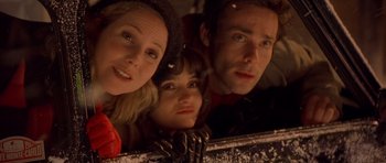 Movie still from “Bridget Jones's Diary” (2001), directed by Sharon Maguire – A group of people standing next to each other in a room; Close Up shot, High angle