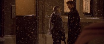 Movie still from “Bridget Jones's Diary” (2001), directed by Sharon Maguire – A man and a woman standing next to each other in the snow; Wide shot, Over the shoulder angle