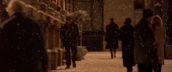 Movie still from “Bridget Jones's Diary” (2001), directed by Sharon Maguire – A couple of people walking down a snowy sidewalk; Wide shot, High angle