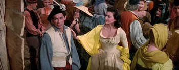 Movie still from “Brigadoon” (1954), directed by Vincente Minnelli – A man and a woman dressed in medieval clothing; Medium shot, Over the shoulder angle