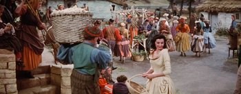 Movie still from “Brigadoon” (1954), directed by Vincente Minnelli – A crowd of people gathered around a market; Wide shot, High angle