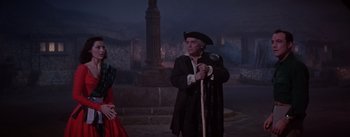 Movie still from “Brigadoon” (1954), directed by Vincente Minnelli – A man and a woman dressed in medieval clothing; Medium shot, Over the shoulder angle