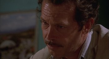 Movie still from “Bring Me the Head of Alfredo Garcia” (1974), directed by Sam Peckinpah – A person with a beard and a mustache; Close Up shot, Low angle