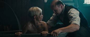 Movie still from “The Book Thief” (2013), directed by Brian Percival – A man and a woman are looking at each other; Medium shot, Over the shoulder angle